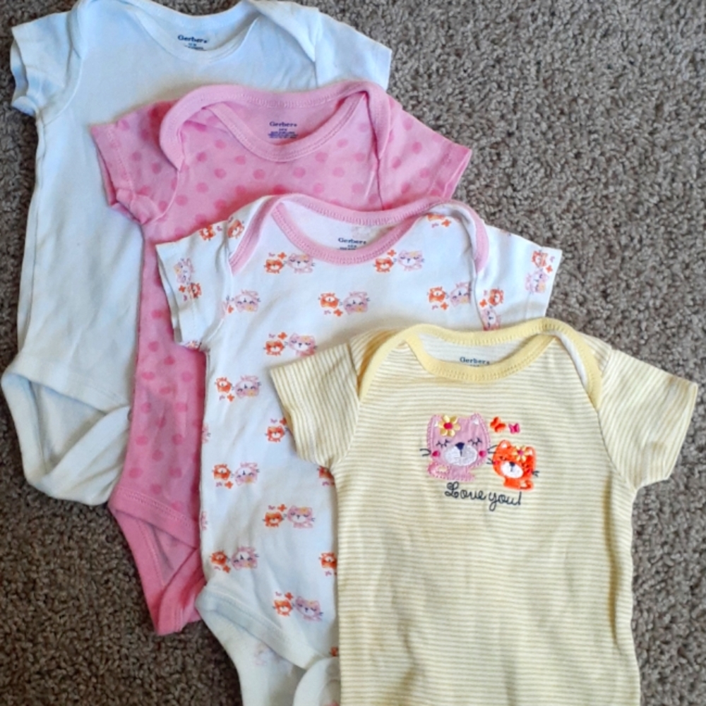 Four 6-9 Month Onesies